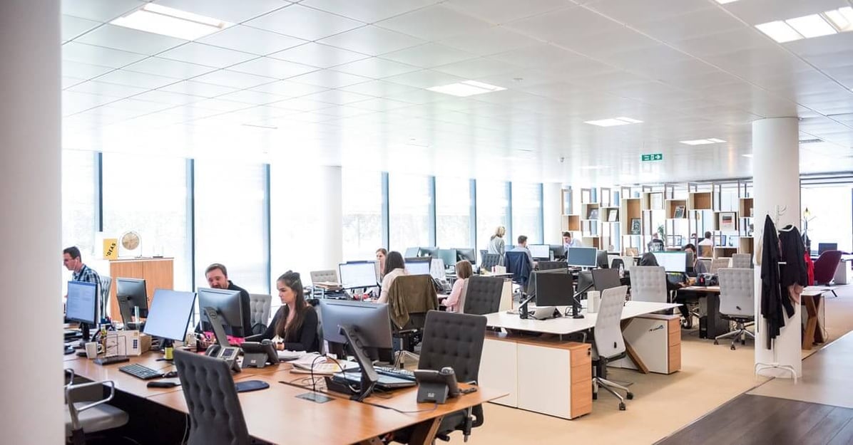 light office space with multiple teams - photo by Arlington Research via Unsplash